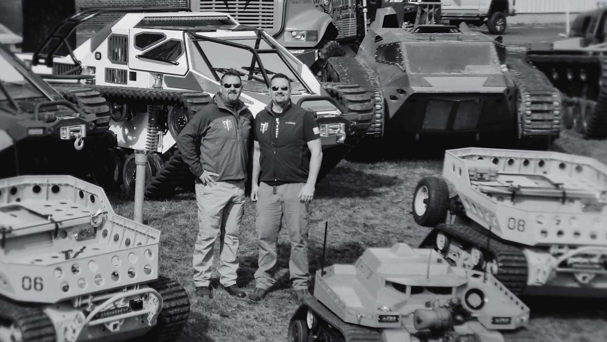 Howe Brothers surrounded by machinery