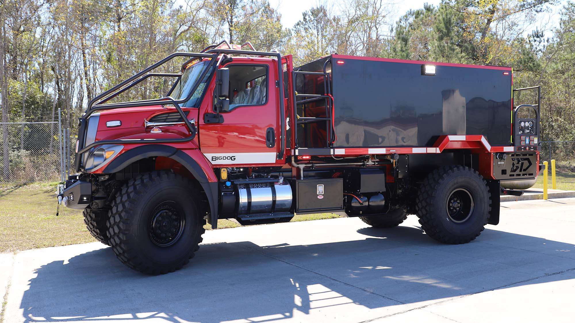Red Big Dog parked in parking lot