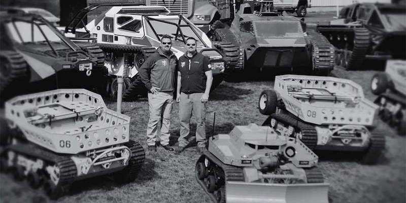 Howe Brothers surrounded by machinery